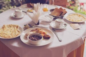 a table with a white tablecloth and a healthy breakfast