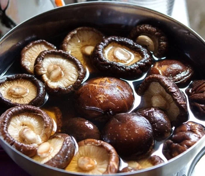 shiitake mushrooms in a pot of water